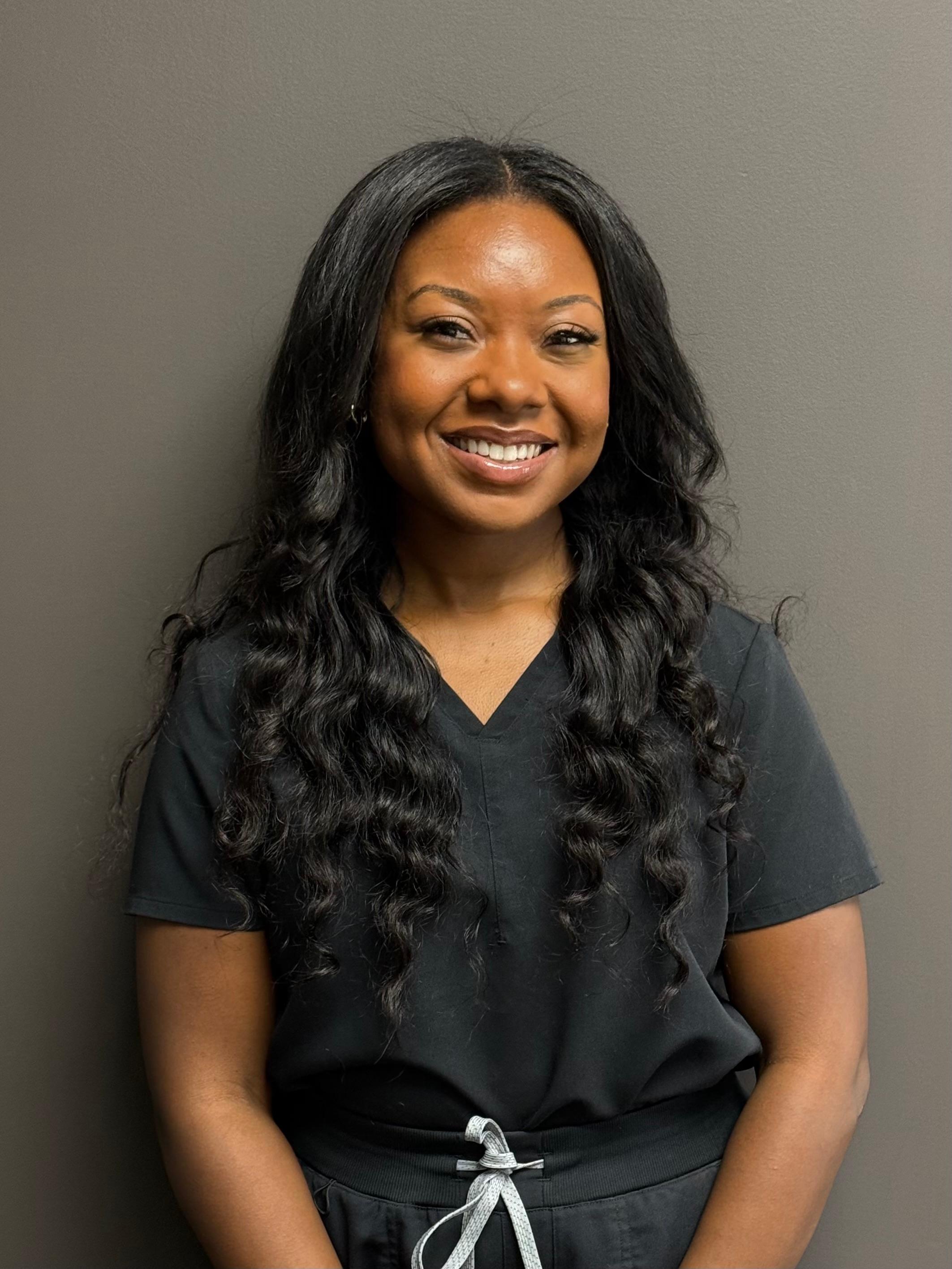 Professional and friendly staff member at Carmel Dental Care, ready to assist patients with their dental needs and provide exceptional care.