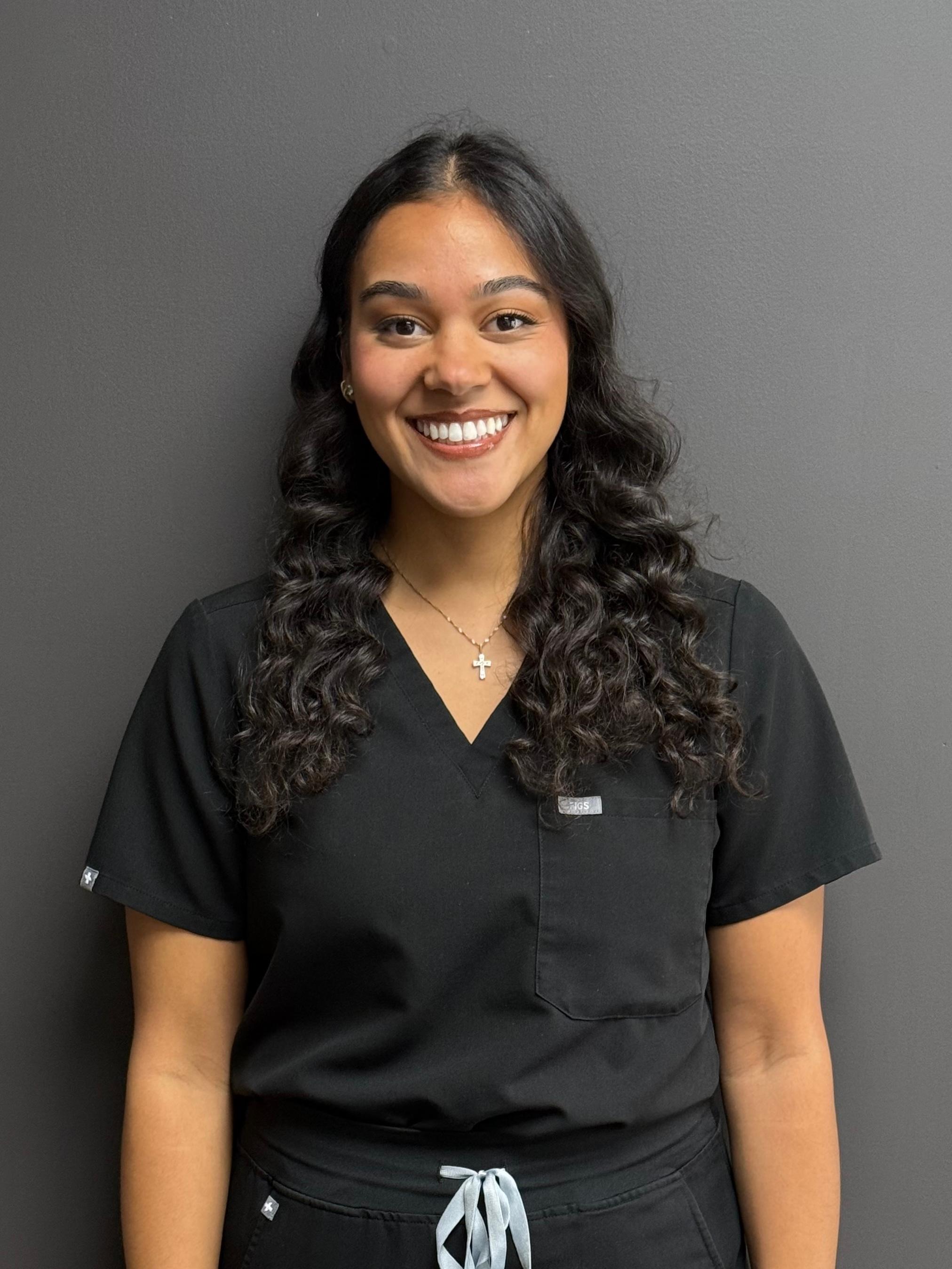 Professional and friendly staff member at Carmel Dental Care, ready to assist patients with their dental needs and provide exceptional care.