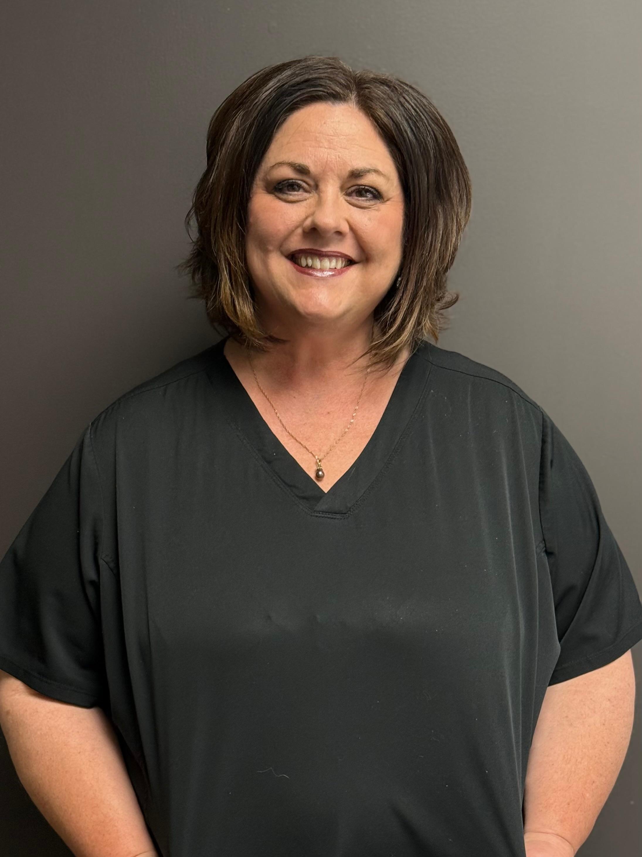 Professional and friendly staff member at Carmel Dental Care, ready to assist patients with their dental needs and provide exceptional care.