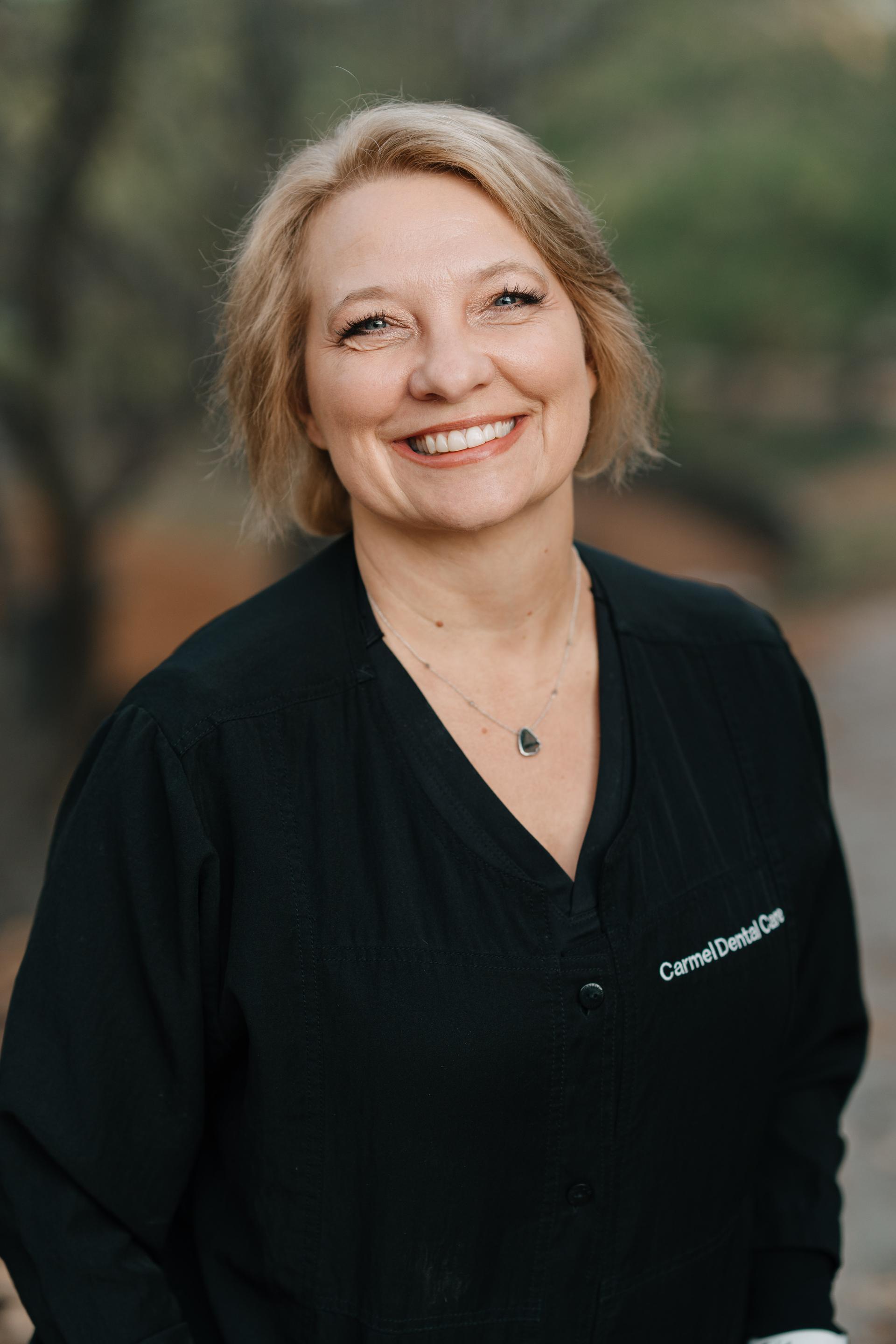 Professional and friendly staff member at Carmel Dental Care, ready to assist patients with their dental needs and provide exceptional care.