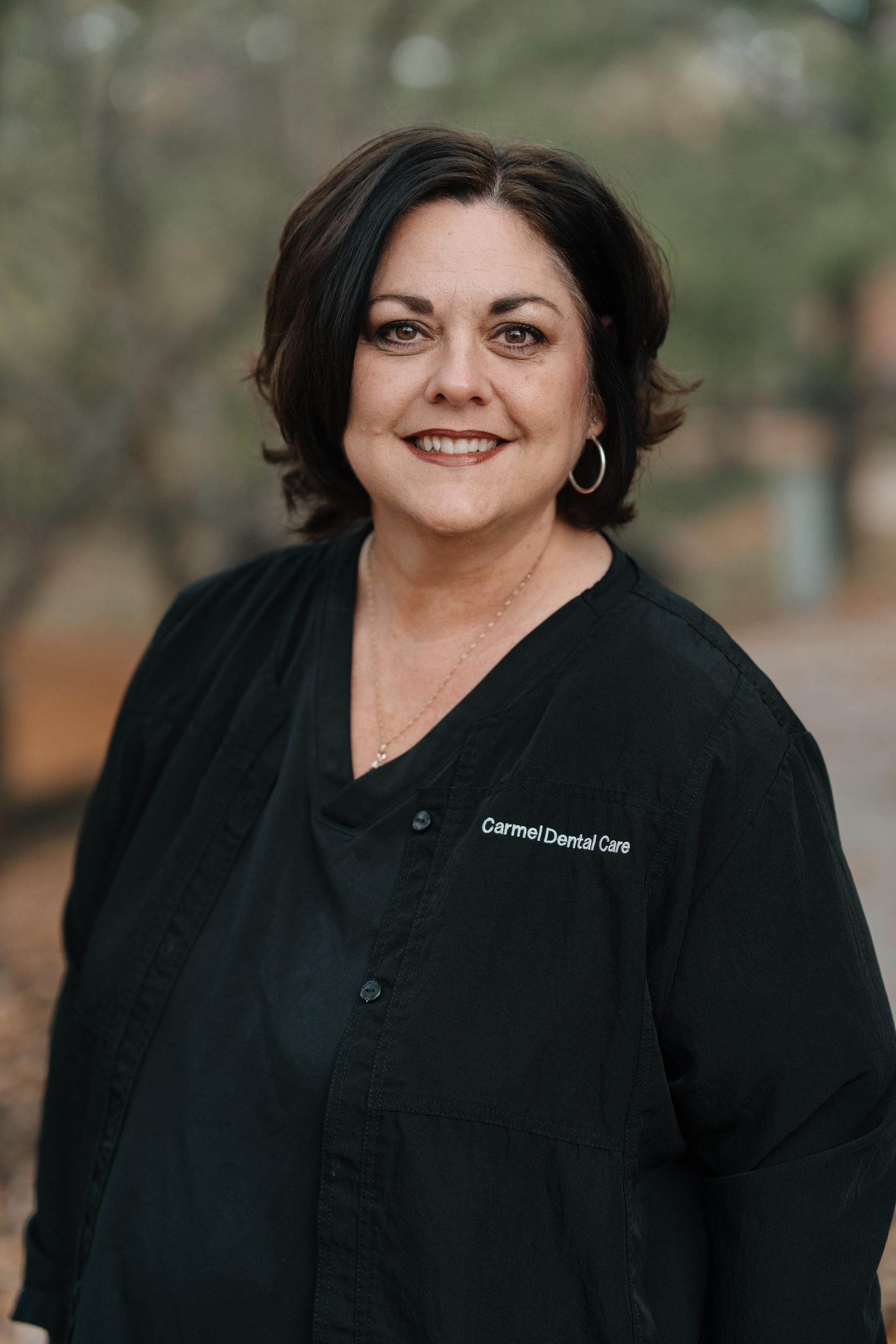 Professional and friendly staff member at Carmel Dental Care, ready to assist patients with their dental needs and provide exceptional care.